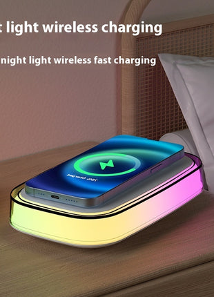 Wireless charging pad with night light feature on a bedside table.