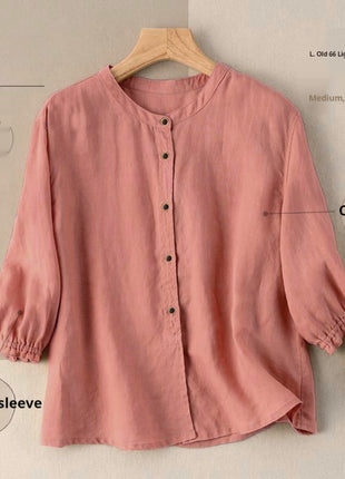 Pink cardigan on a hanger with annotations on a beige background