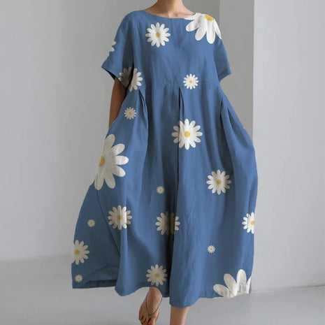 Blue dress with white floral patterns on a plain background