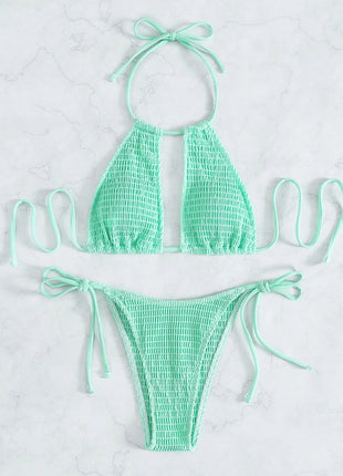 Mint green bikini set on a light gray background