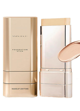 Makeup stick with gold casing and open lid showing cream texture on a white background