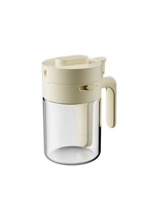 Clear glass mug with beige lid and handle on a white background