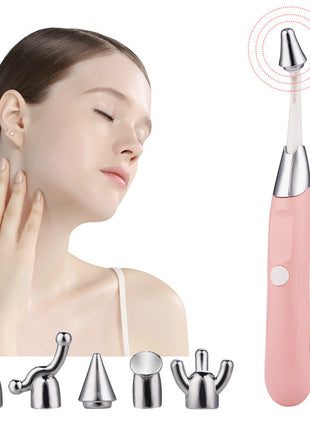 Pink skin care tool with interchangeable heads on a white background