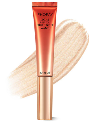 A PHOFAY Highlighter Wand in a golden bronze shade, with a swatch of the product showing its luminous and creamy texture.