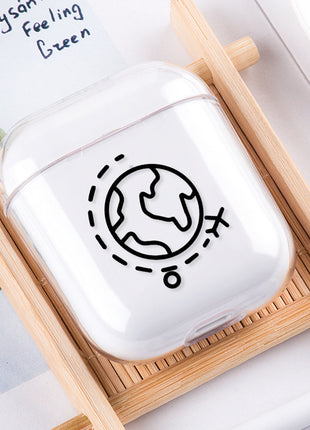 White air pod case with black design on a wooden tray