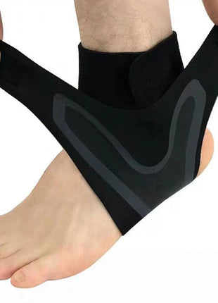 Black ankle support brace being worn on a foot against a white background