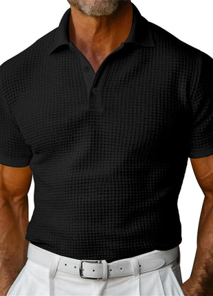 Black patterned polo shirt worn by a person on a white background