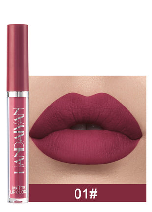 A swatch of a liquid lipstick in a dark red shade, with the product's packaging indicating the shade as '01#'.