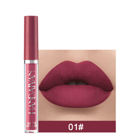 A swatch of a liquid lipstick in a dark red shade, with the product's packaging indicating the shade as '01#'.