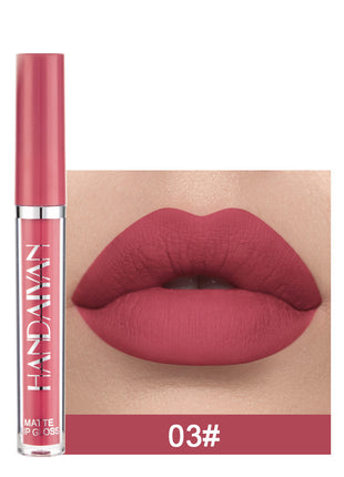 A swatch of a liquid lipstick in a dark red shade, with the product's packaging indicating the shade as '01#'.