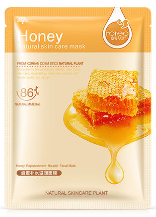 Honey natural skin care mask packaging with a honeycomb and honey drizzle on a white background