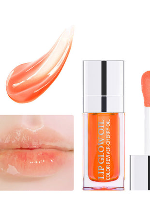 A collection of lip gloss lipsticks in various colors, displayed in clear tubes with silver caps, arranged on a white surface with lighting that creates reflections and highlights.