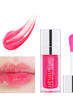 A collection of lip gloss lipsticks in various colors, displayed in clear tubes with silver caps, arranged on a white surface with lighting that creates reflections and highlights.