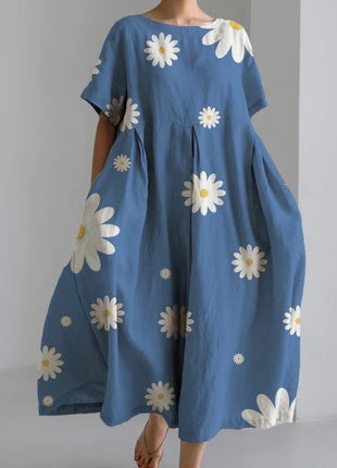 Blue dress with white floral patterns on a plain background