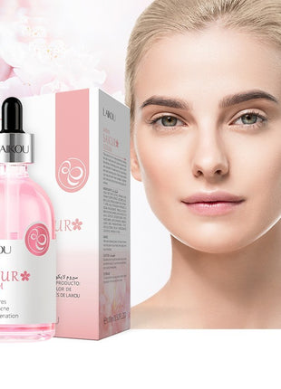 LAIKOU Sakura Serum bottle and packaging with a model's face in the background
