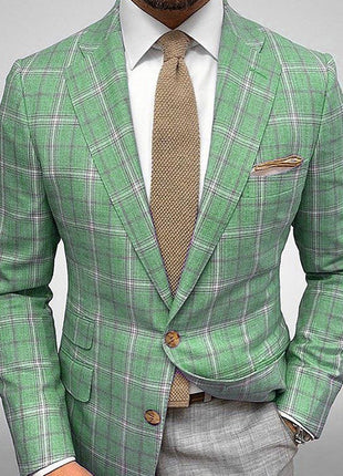 Green plaid suit with a brown tie on a gray background