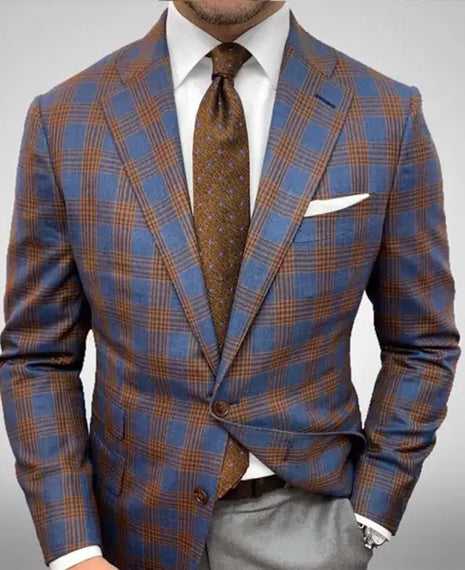 Plaid suit jacket with brown tie and pocket square on a gray background