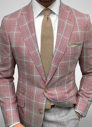 Pink plaid suit with a beige tie on a gray background