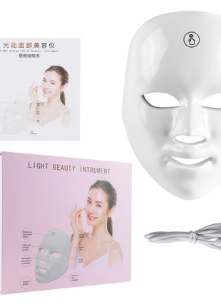 Light beauty instrument with packaging, mask, and cable on a white background