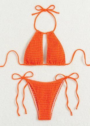 Orange bikini set with smocked texture on a white background