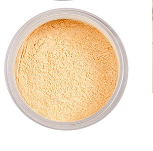 Light-colored powder in a small container on a white background