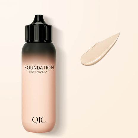 QIC foundation bottle with a swatch on a beige background