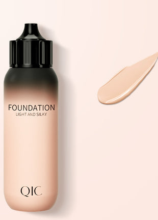 QIC foundation bottle with a swatch on a light beige background