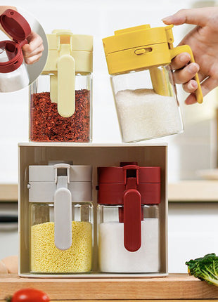 Set of four colorful kitchen containers with lids on a wooden surface.