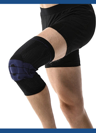 Person wearing a black knee brace on one knee against a white background