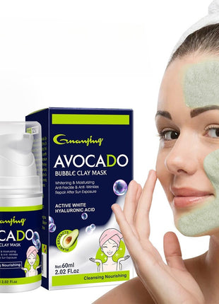 Woman applying avocado bubble clay mask with product packaging in the background