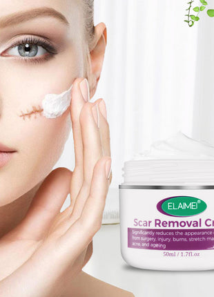 Woman applying scar removal cream to her face with a jar of ELAIMEI scar removal cream next to her.
