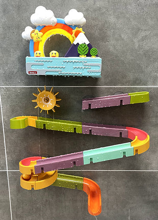 Colorful toy track set on a tiled bathroom wall